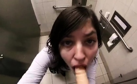 Naughty Amateur Teen Deepthroats A Dildo In A Public Toilet