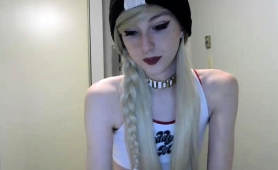 petite-blonde-shemale-caresses-her-long-shaft-on-webcam