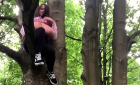 voluptuous-brunette-showing-off-her-huge-tits-in-the-woods