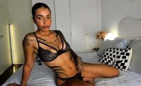 Tattooed Seductress Posing In Sexy Black Lingerie On The Bed