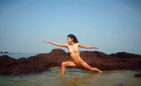 hot-teen-stripping-seductively-and-posing-naked-on-the-beach